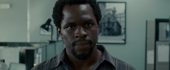 Movie still from “Edge of Darkness” (2010), directed by Martin Campbell – A person wearing a striped shirt; Close Up shot, Low angle