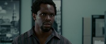 Movie still from “Edge of Darkness” (2010), directed by Martin Campbell – A person wearing a striped shirt; Close Up shot, Over the shoulder angle