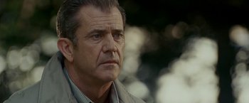 Movie still from “Edge of Darkness” (2010), directed by Martin Campbell – An older man is looking into the distance; Close Up shot, Low angle