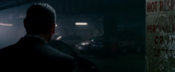 Movie still from “Edge of Darkness” (2010), directed by Martin Campbell – A man sitting in the back of a car at night; Close Up shot, Over the shoulder angle