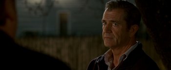 Movie still from “Edge of Darkness” (2010), directed by Martin Campbell – An older man is looking into the distance; Close Up shot, Over the shoulder angle