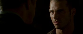 Movie still from “Edge of Darkness” (2010), directed by Martin Campbell – A man's face in the dark; Close Up shot, Over the shoulder angle