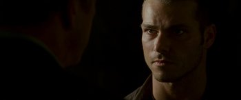 Movie still from “Edge of Darkness” (2010), directed by Martin Campbell – A man's face in the dark; Close Up shot, Over the shoulder angle