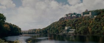 Movie still from “Edge of Darkness” (2010), directed by Martin Campbell – A large body of water near a forest; Extreme Wide shot, Low angle