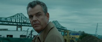 Movie still from “Edge of Darkness” (2010), directed by Martin Campbell – A person wearing a jacket; Close Up shot, Over the shoulder angle