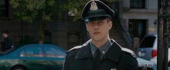 Movie still from “Edge of Darkness” (2010), directed by Martin Campbell – A man in a police officer's uniform and hat; Close Up shot, Over the shoulder angle