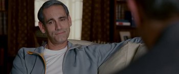 Movie still from “Edge of Darkness” (2010), directed by Martin Campbell – A person sitting on a couch; Close Up shot, Over the shoulder angle