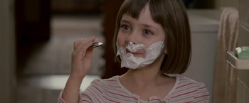 Movie still from “Edge of Darkness” (2010), directed by Martin Campbell – A young girl shaving her face with a razor; Close Up shot, Over the shoulder angle