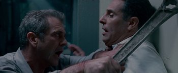 Movie still from “Edge of Darkness” (2010), directed by Martin Campbell – Two men are fighting with each other in a room; Close Up shot, Low angle