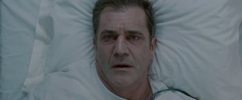 Movie still from “Edge of Darkness” (2010), directed by Martin Campbell – A person laying in a bed; Close Up shot, Overhead angle