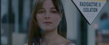 Movie still from “Edge of Darkness” (2010), directed by Martin Campbell – A person with long brown hair; Close Up shot, Over the shoulder angle