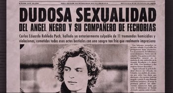 Movie still from “El Angel” (2018), directed by Luis Ortega – A black and white photo of a newspaper with a picture of a man; Extreme Close Up shot, Overhead angle