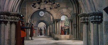 Movie still from “El Cid” (1961), directed by Anthony Mann – A group of people standing in a room; Extreme Wide shot, High angle