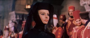 Movie still from “El Cid” (1961), directed by Anthony Mann – A person wearing a black outfit; Close Up shot, Low angle