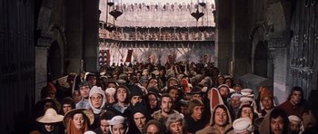 Movie still from “El Cid” (1961), directed by Anthony Mann – A large group of people gathered together in a building; Extreme Wide shot, High angle