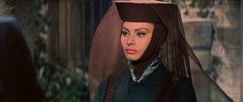 Movie still from “El Cid” (1961), directed by Anthony Mann – A person wearing a hat; Close Up shot, High angle