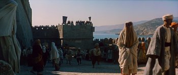Movie still from “El Cid” (1961), directed by Anthony Mann – A group of people standing next to each other on top of a hill; Extreme Wide shot, Low angle