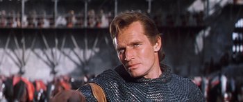 Movie still from “El Cid” (1961), directed by Anthony Mann – A person wearing a chainmail vest; Close Up shot, Low angle