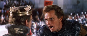 Movie still from “El Cid” (1961), directed by Anthony Mann – A person with a crown; Close Up shot, Over the shoulder angle