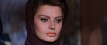 Movie still from “El Cid” (1961), directed by Anthony Mann – A person wearing a head scarf; Close Up shot, Over the shoulder angle