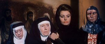 Movie still from “El Cid” (1961), directed by Anthony Mann – A nun and a woman in a black hooded cloak; Close Up shot, Low angle