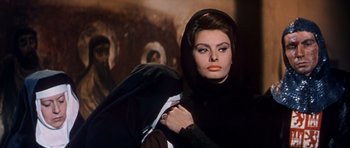 Movie still from “El Cid” (1961), directed by Anthony Mann – A woman in a black outfit and a black veil; Close Up shot, Low angle