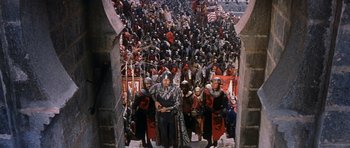 Movie still from “El Cid” (1961), directed by Anthony Mann – A group of people dressed in medieval costumes; Wide shot, High angle