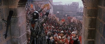 Movie still from “El Cid” (1961), directed by Anthony Mann – A group of people in medieval costumes in front of a crowd of people; Extreme Wide shot, High angle