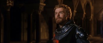 Movie still from “El Cid” (1961), directed by Anthony Mann – A man with a beard wearing a chain mail collar; Close Up shot, Low angle