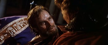 Movie still from “El Cid” (1961), directed by Anthony Mann – A person talking to another person; Close Up shot, Over the shoulder angle