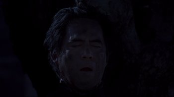 Movie still from “El Norte” (1983), directed by Gregory Nava – A man with blood all over his face and head; Close Up shot, Overhead angle