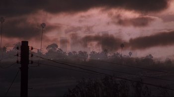 Movie still from “El Norte” (1983), directed by Gregory Nava – A view of a city skyline in the dark; Extreme Wide shot, Low angle