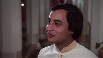 Movie still from “El Norte” (1983), directed by Gregory Nava – A man in a white shirt is looking to his left; Close Up shot, Low angle