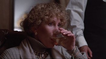Movie still from “El Norte” (1983), directed by Gregory Nava – A woman drinking a beverage from a wine glass; Close Up shot, Low angle