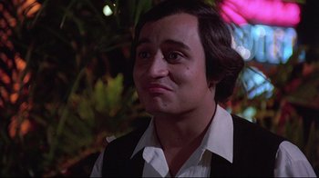 Movie still from “El Norte” (1983), directed by Gregory Nava – A person wearing a shirt and vest; Close Up shot, Low angle