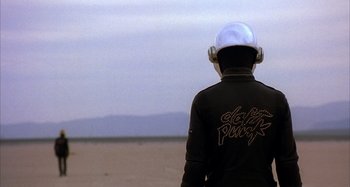 A person wearing a helmet and a black jacket