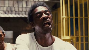 Movie still from “Elite Squad 2: The Enemy Within” (2010), directed by José Padilha – A person with his mouth wide open; Close Up shot, Low angle