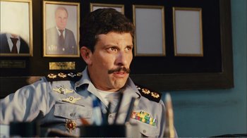 Movie still from “Elite Squad 2: The Enemy Within” (2010), directed by José Padilha – A person wearing a uniform; Close Up shot, Low angle