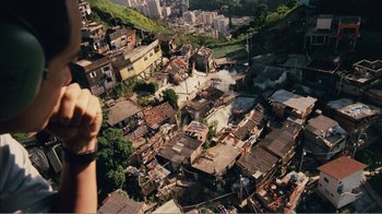 Movie still from “Elite Squad 2: The Enemy Within” (2010), directed by José Padilha – An aerial view of an urban area with buildings and trees; Extreme Wide shot, Overhead angle