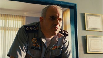 Movie still from “Elite Squad 2: The Enemy Within” (2010), directed by José Padilha – A person wearing a uniform; Close Up shot, Low angle