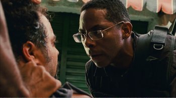 Movie still from “Elite Squad 2: The Enemy Within” (2010), directed by José Padilha – A man wearing glasses talking to another man; Close Up shot, Over the shoulder angle
