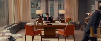 Movie still from “The Proposal” (2009), directed by Anne Fletcher – A woman sitting at a desk in an office setting; Wide shot, High angle