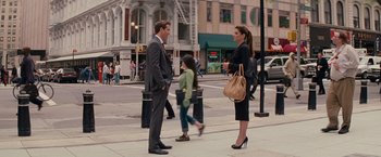 Movie still from “The Proposal” (2009), directed by Anne Fletcher – A man and a woman standing on the sidewalk; Wide shot, Over the shoulder angle