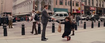 Movie still from “The Proposal” (2009), directed by Anne Fletcher – A man and a woman shaking hands on the sidewalk; Wide shot, High angle
