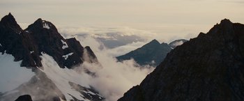 Movie still from “The Proposal” (2009), directed by Anne Fletcher – A view of a mountain range with clouds in the distance; Extreme Wide shot, Low angle