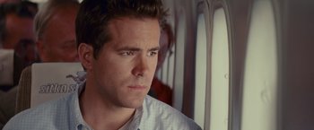 Movie still from “The Proposal” (2009), directed by Anne Fletcher – A person looking at the camera; Close Up shot, Low angle