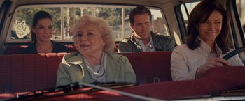 Movie still from “The Proposal” (2009), directed by Anne Fletcher – A man and a woman sitting in the back of a car; Medium shot, Over the shoulder angle
