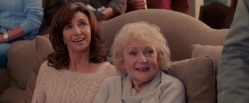 Movie still from “The Proposal” (2009), directed by Anne Fletcher – Two women sitting next to each other on a couch; Medium shot, High angle