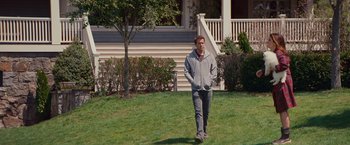 Movie still from “The Proposal” (2009), directed by Anne Fletcher – A man walking across a lush green field; Wide shot, Over the shoulder angle