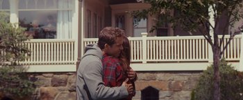 Movie still from “The Proposal” (2009), directed by Anne Fletcher – A man and a woman hugging in front of a house; Medium shot, Over the shoulder angle